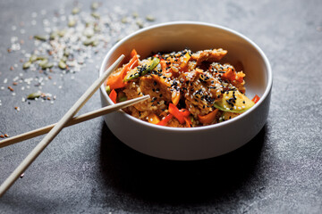 Japanese rice salad with sesame seeds, chicken and vegetables.