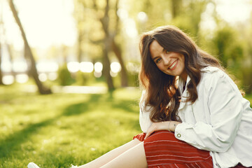 Stylish woman spending time in a spring park