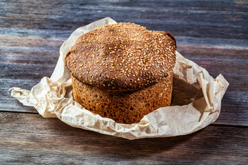 Traditional bread with a crust on a wooden board