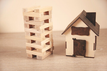 house model and wooden Architectural cubes on table