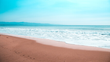 Fototapeta na wymiar Soft waves of sea on the beach of Poetto