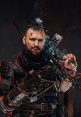 Fototapeta premium Smoking cigar confident stalker with shotgun on his shoulder