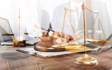 Business and lawyers discussing contract papers with brass scale on desk in office. Law, legal...