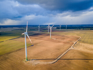 Aerial photo of wind farms in the middle of the fields.