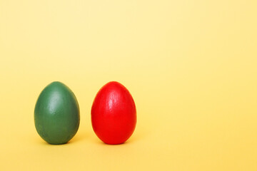 Easter eggs on a yellow paper background. Hand made things.