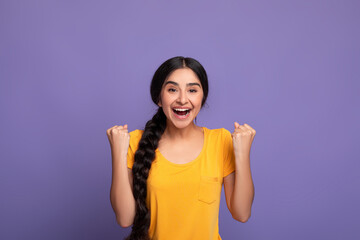 Yes. Portrait of emotional indian woman screaming with raised fists