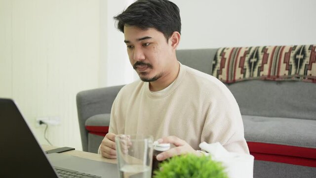 slow motion scene young man video streaming conference to consulting about male hormone and physical with specialist and listen explaining at home for telemedicine health technology life concept	