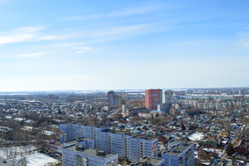 Fototapeta na wymiar view of the city and multi-storey and one-storey buildings on a sunny day