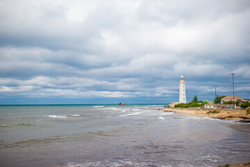 White lighthouse in a bay at sea