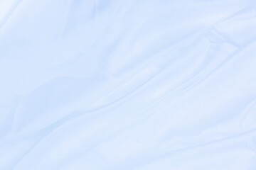 Obraz premium White cloth background abstract with soft waves,Closeup elegant crumpled of white silk fabric cloth background and texture. Luxury background design.