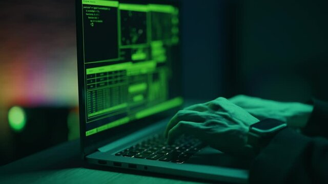 Close up of developing programming and coding technologies. Programmer hands are typing on keyboard. Software coder or blockchain developer at night. Concept of bitcoin cryptocurrency and wallet hack