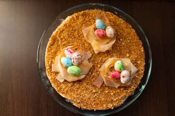 Easter cake with yellow mirror glaze, chocolate.