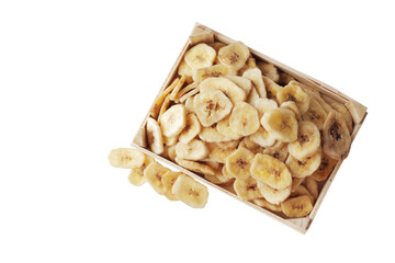 Wooden bowl with sweet banana slices on white background, top view. Dried fruit as healthy snack