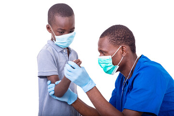 doctor examining a little boy.