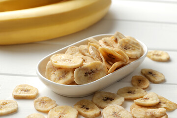 banana chips, dried fruit on a wooden table. Dried fruit as healthy snack. Healthy breakfast