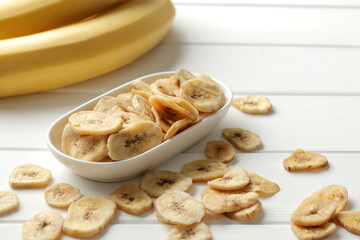 banana chips, dried fruit on a wooden table. Dried fruit as healthy snack. Healthy breakfast