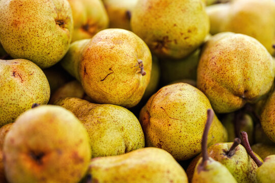 Pears on display at street food market, closeup detail