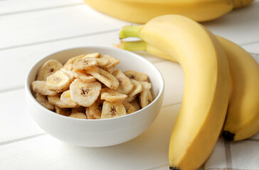 banana chips, dried fruit on a wooden table. Dried fruit as healthy snack. Healthy breakfast