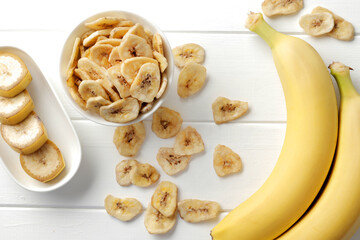banana chips, dried fruit on a wooden table. Dried fruit as healthy snack. Healthy breakfast