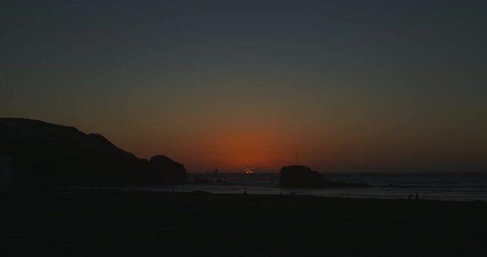 Time lapse of sunset behind Chapel Rock at Perranporth Beach