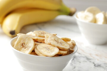 Composition with sweet banana slices   , top view with space for text. Dried fruit as healthy snack. Healthy breakfast