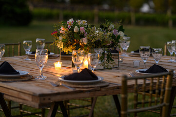 table set for a wedding reception outdoors