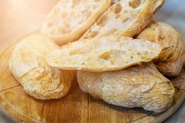 Bakery - gold rustic crusty loaves of bread and buns. High quality photo