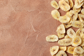 Heap of sweet banana slices on  a  background. Dried fruit as healthy snack