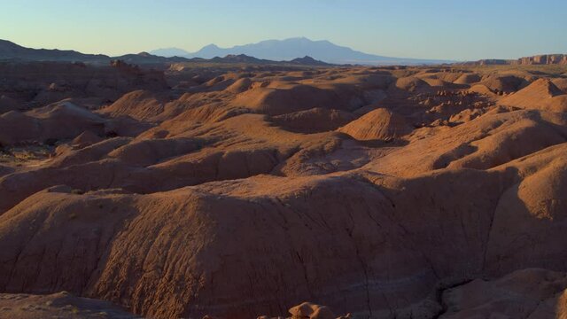 Aerial, rolling desert landscape in Utah