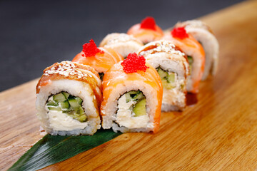 Seafood delicatessen sushi rolls set on board