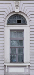  Windows in the city in the old style, with stucco, decorative elements