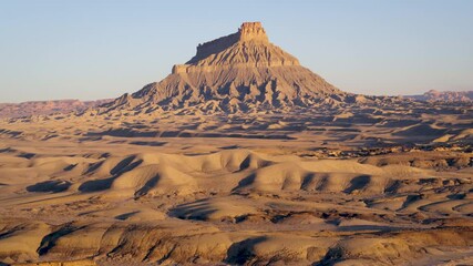 Tall mountain in Goblin Valley State Park, wide aerial