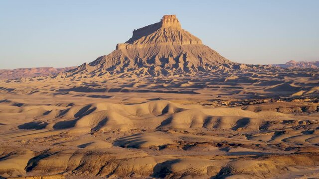 Tall mountain in Goblin Valley State Park, wide aerial