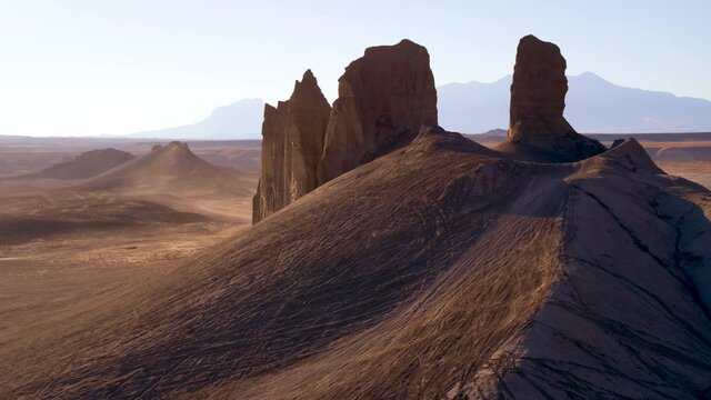 Rock formations in Goblin Valley State Park at sunset, wide aerial