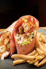 Baja fish wrap.  Cod, avocado, salsa, citrus slaw, wrapped in a tortilla.