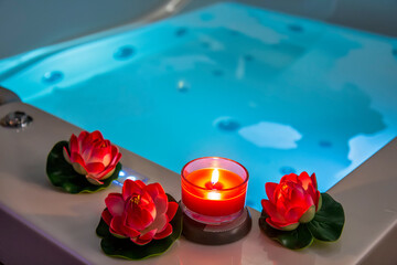 Hot tub with candles and water lilies - obrazy, fototapety, plakaty