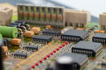 Close-up of electronic circuit board PCB with microchip, integrated circuits, resistances and...