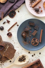 Chocolate and spices on the table, top view, home cooking, sweet food