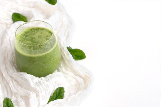 Raw Green Smoothie In A Glass On A White Background