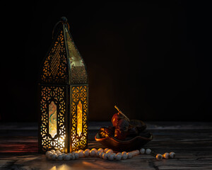 Traditional lantern, dates fruit and rosary beads for Ramadan and Eid greeting 