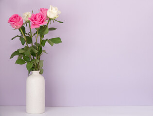 Rose placed on the desk in blue background