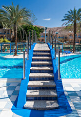 Swimming pool and decorative bridge in tourist resort, Middle East