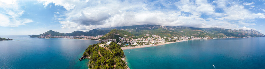 Beautiful view from sea to Budva coast and resort town of Becici on background of mountains, Montenegro