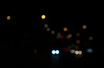 Night lights blurry, bokeh, defocused at street in the city abstract background.