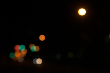 Abstract city night lights circular blurry background. Beautiful yellow, green colors bokeh. Horizontal image style.