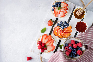 Obraz na płótnie Canvas sandwiches with berries honey and jam