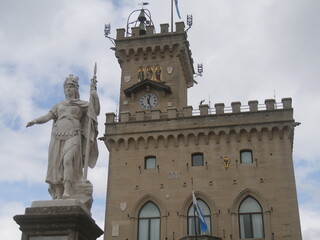 Fototapeta na wymiar San Marino - Statue of Liberty in white marble represents a warrior with a crown with the three towers of the town.