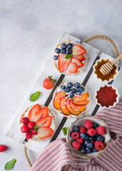 Obraz na płótnie Canvas sandwiches with berries honey and jam