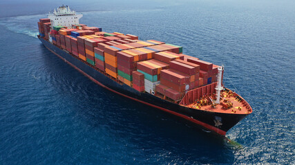 Aerial drone photo of container cargo ship in import export business commercial trade logistic and...