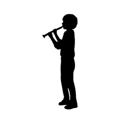 Fototapeta premium Silhouette boy playing the flute.